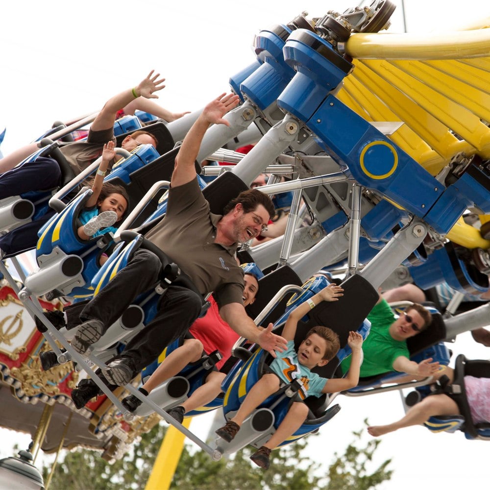 Father and son riding the Freedom Flyer roller coaster